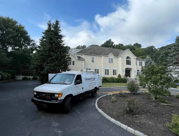 Parma Heights Power Washing technician performing thorough gutter cleaning service in Parma Heights