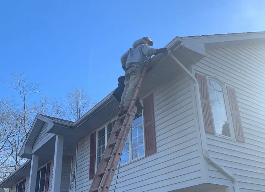 Gutter cleaning and maintenance being performed by Parma Heights Power Washing in Parma Heights